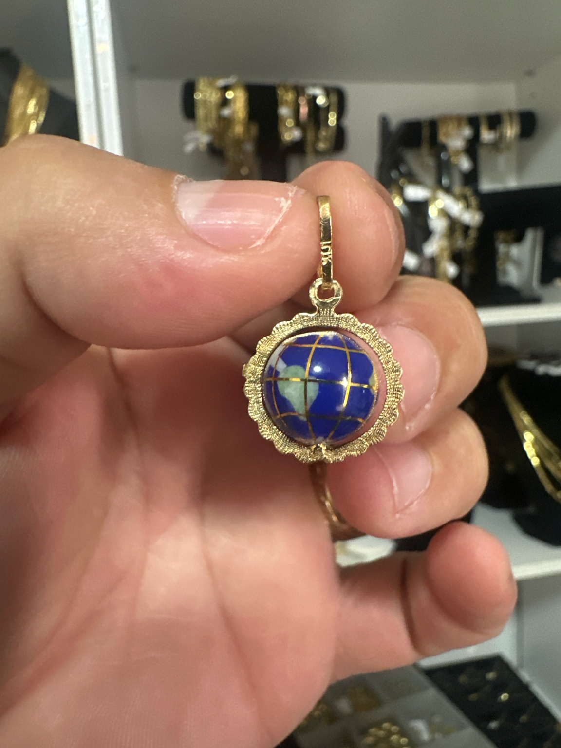 Beautiful Globe Pendant in Real Solid 10K Gold. This unique and elegant world globe design features a detailed blue enamel finish with luxurious gold accents, symbolizing travel, dreams, and connection around the world. Crafted in genuine solid 10K gold w